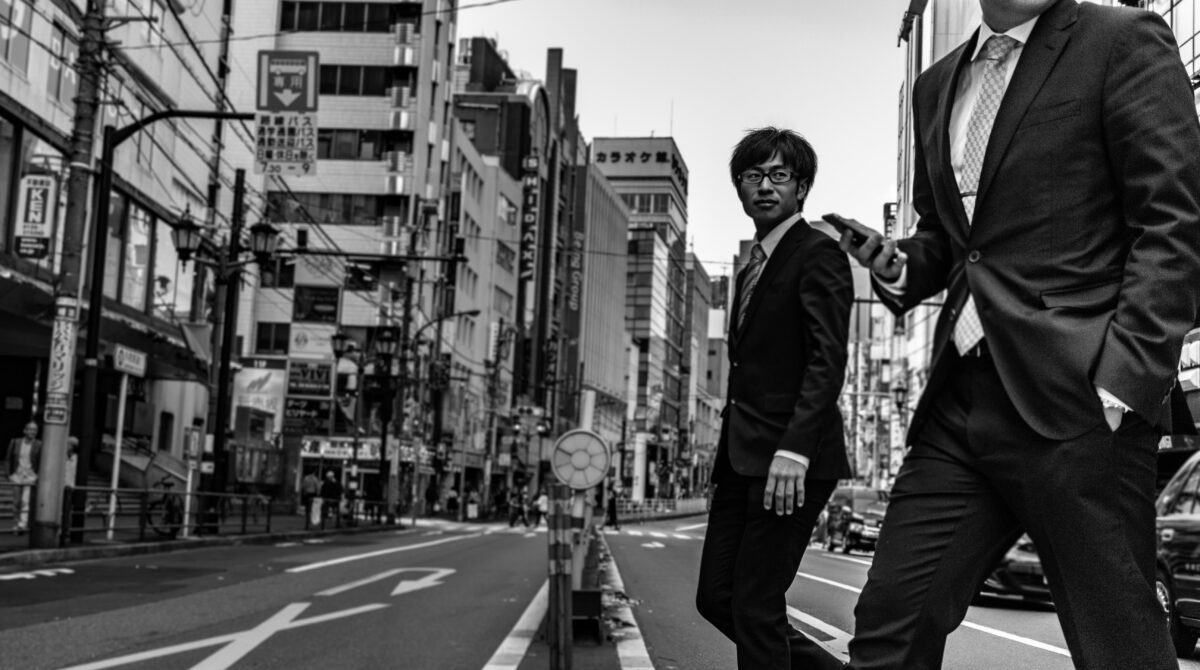 man crossing street in Japan