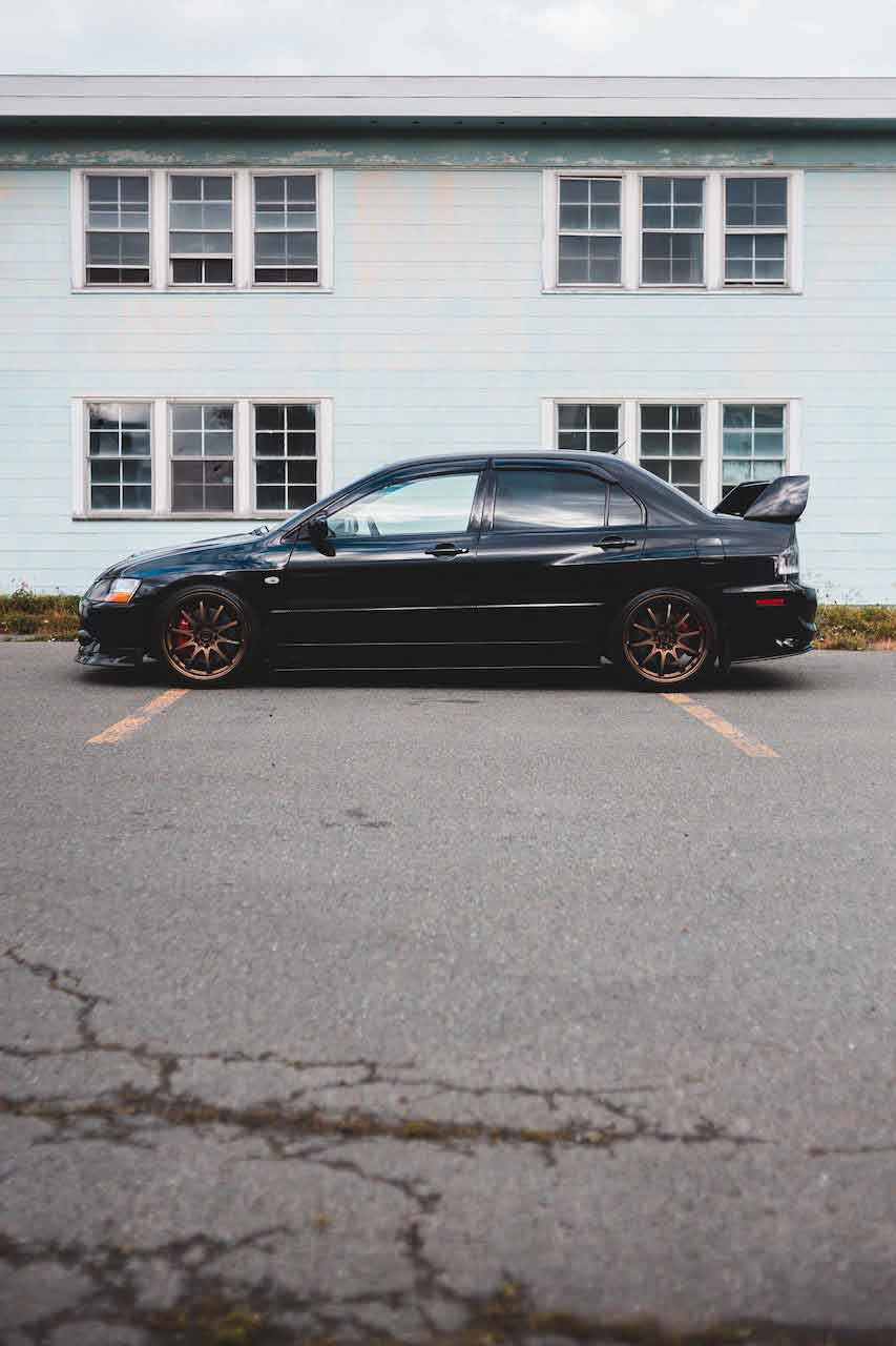 Car parked across multiple car spaces