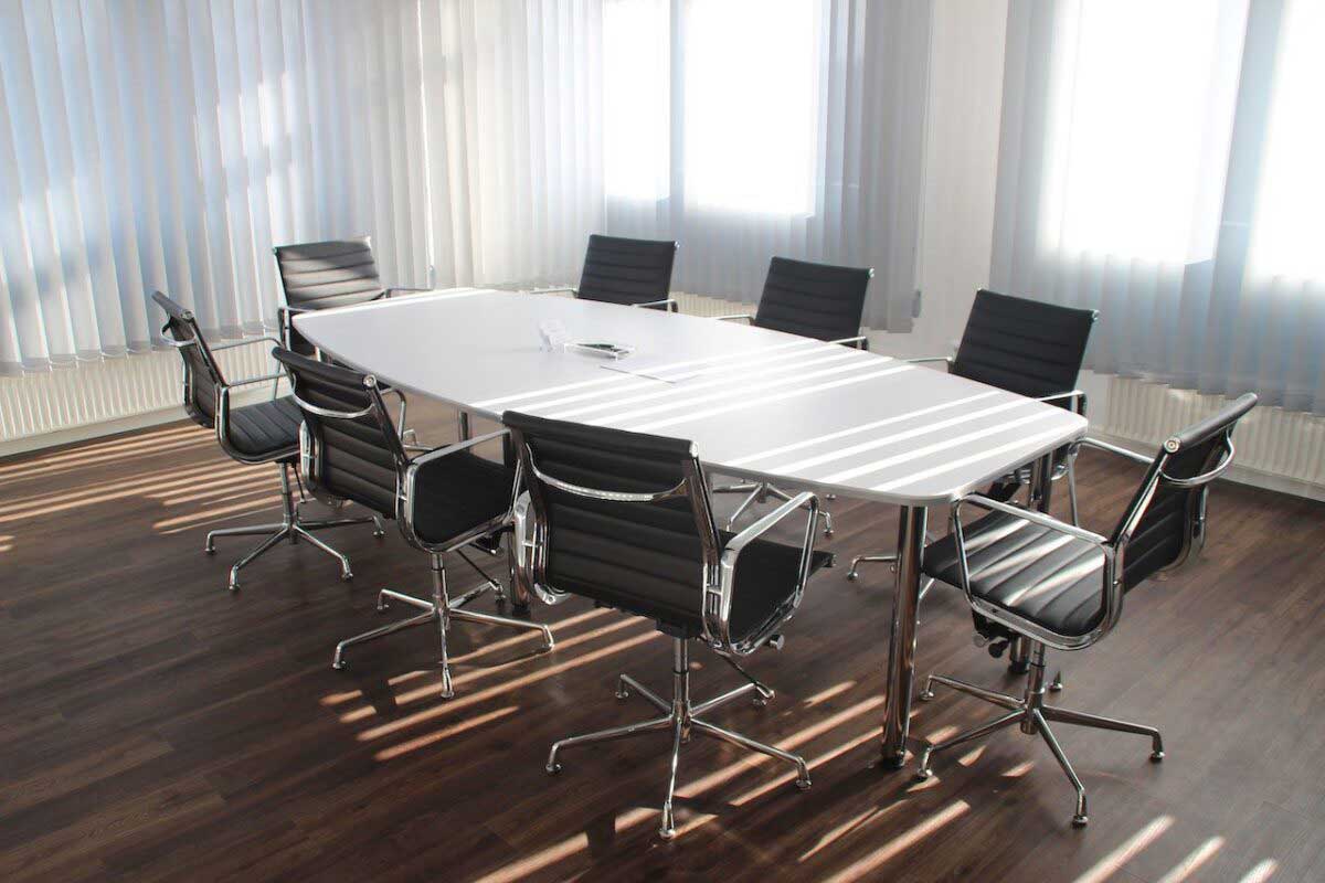 Company boardroom with empty chairs