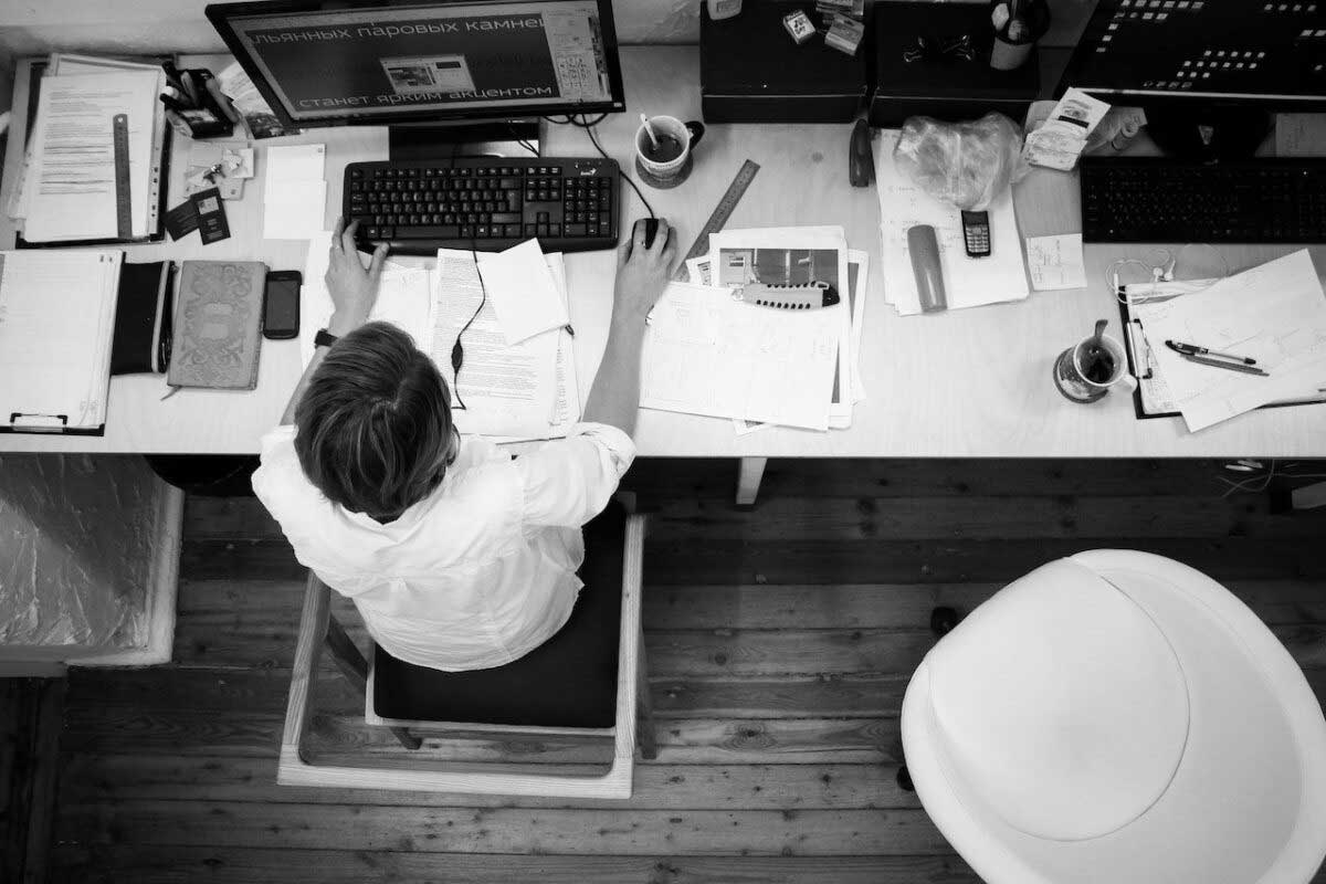 Man working at desk in his company